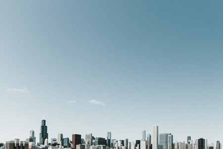 Sunny blue sky above highrise cityscape Chicago Illinois USA