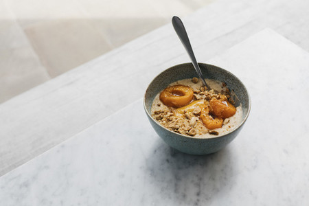 Roasted apricot porridge with almond milk and nuts