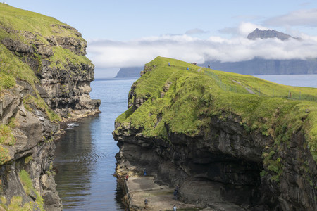 Moss covered rock formations Faroe Islands