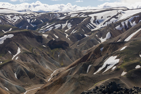 Snow patches on scenic mountain landscape Iceland
