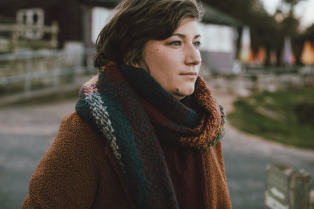 Young woman wearing autumn scarf