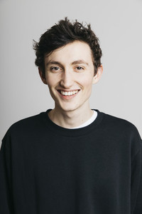 Portrait smiling young brunette man