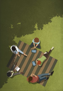 Friends social distancing with book and digital tablets in park