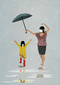 Mother and daughter in face masks running playfully in rain