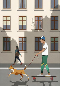 Dog on leash pulling boy riding skateboard on city street