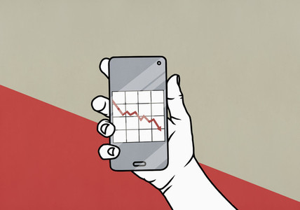 POV Hand holding smart phone with downward graph on screen