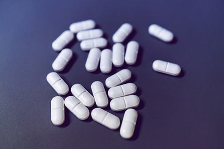 Prescription medication on purple background
