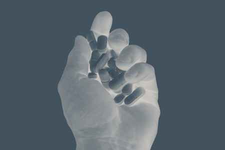 X ray shot hand holding prescription pills