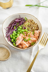 Poke bowl with couscous  baked salmon  bean  and cabbage  Healthy eating concept