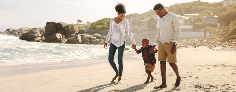 African family on beach walk