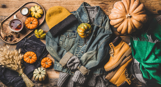 Autumn trendy women outfit layout over wooden background