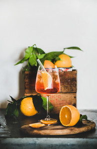 Aperol Spritz cocktail in glass with eco friendly straw  copy space