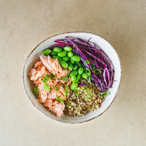 Poke bowl with couscous  baked salmon  bean  and cabbage  Healthy eating concept
