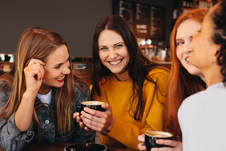 Woman with friends at a coffee shop