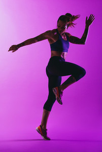 Monochrome portrait of a fit woman exercising