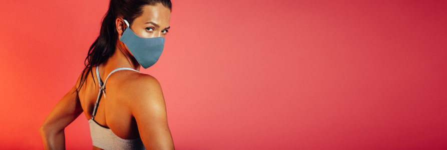 Sportswoman in protecitve face mask
