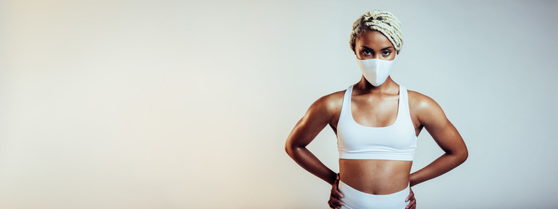 Fitness woman with face mask