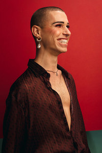 Smiling gay man wearing with earring