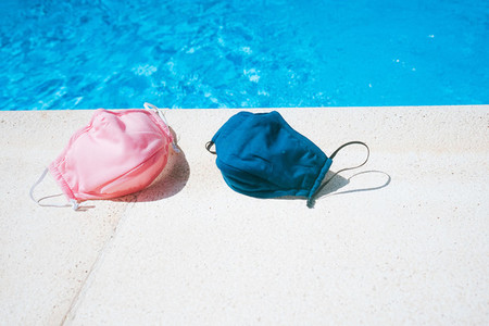 Protective mask near a swimming pool in summer