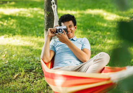 Young man relaxing on hammock