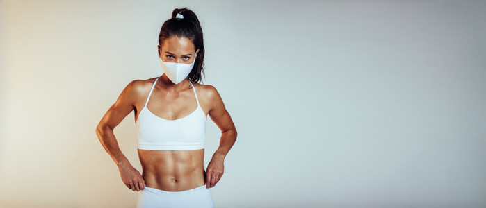 Sporty woman with protective face mask