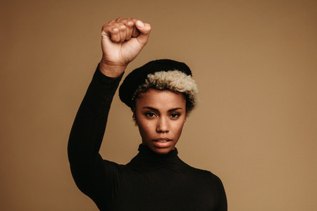 Close up of african american woman with raised fist