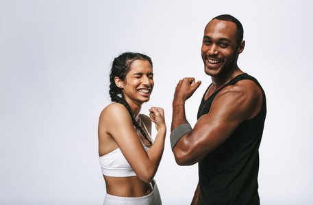 Portrait of laughing fitness couple