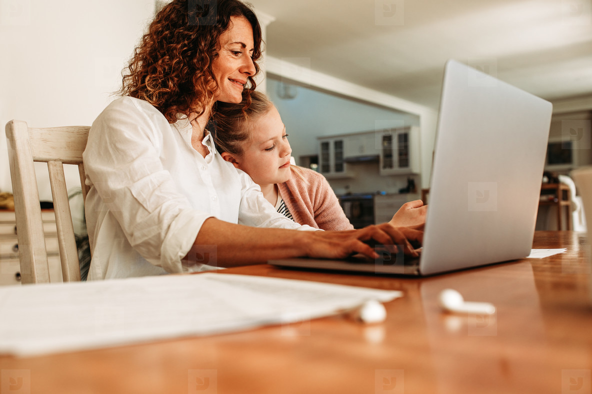 Working mother doing her work at home