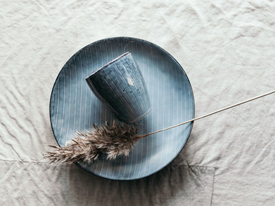 Set of a blue kitchen ceramic tableware oner linen cloth  Eco and minimal style home still life