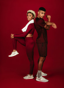 Portrait of fitness couple doing warm up exercises