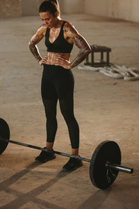 Fitness woman working out at old warehouse