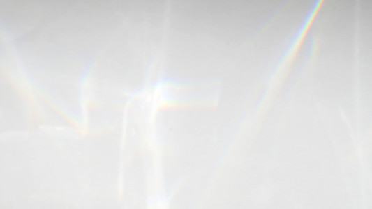 Abstract rainbow rays of light shadow overlay effect from sunlig