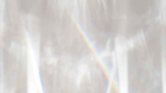 Abstract rainbow rays of light shadow overlay effect from sunlig