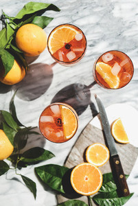 Aperol Spritz cocktail in glasses with oranges  top view