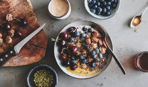 Quinoa oat granola with fresh fruits and cup of coffee