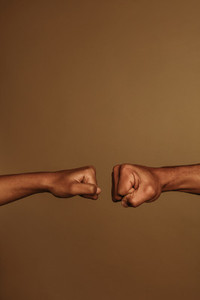 Two hands coming together for a fist bump