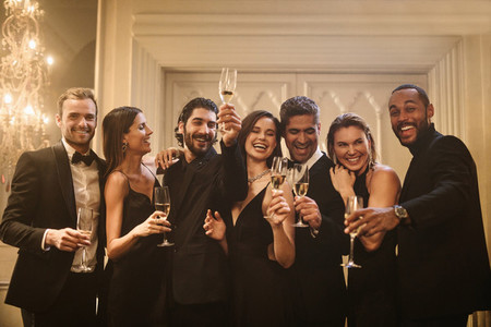 Friends celebrating with champagne at a party