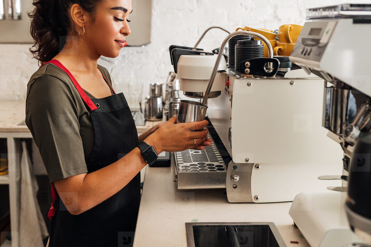 Side view of a female barista