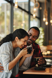Couple having a great time at coffee shop