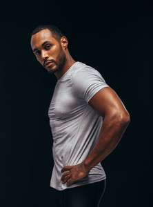 Monochrome fitness portrait of muscular athlete