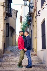 Gay couple in a romantic moment in the street