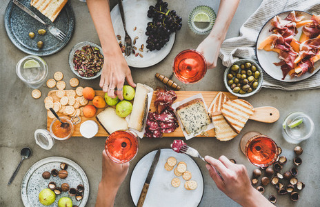 Mid summer seasonal picnic with rose wine cheese charcuterie and appetizers