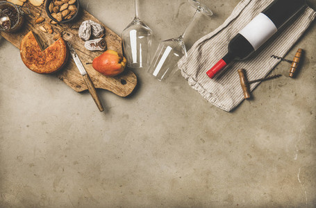 Wine and snack set with over concrete background  copy space