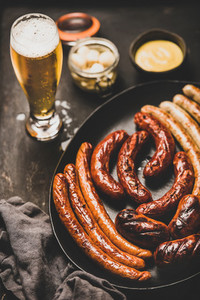 Bavarian dinner with lager beer  sausages  sauce in jars
