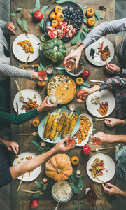 Flat lay of Friends clinking glasses at Thanksgiving Day  vertical composition
