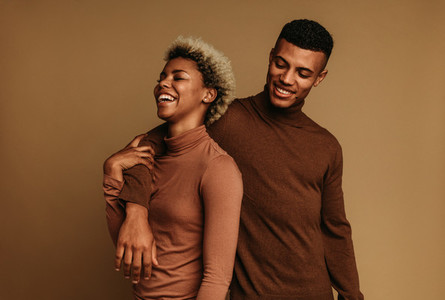Smiling african american man and woman standing together
