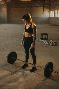 Woman ready to lift barbell