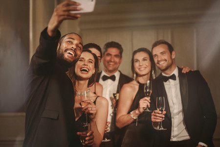 Friends taking selfie at new years party