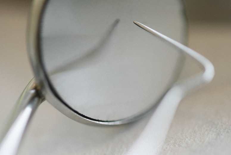 Close up dental scraper and mirror