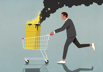 Businessman pushing shopping cart with burning oil barrel